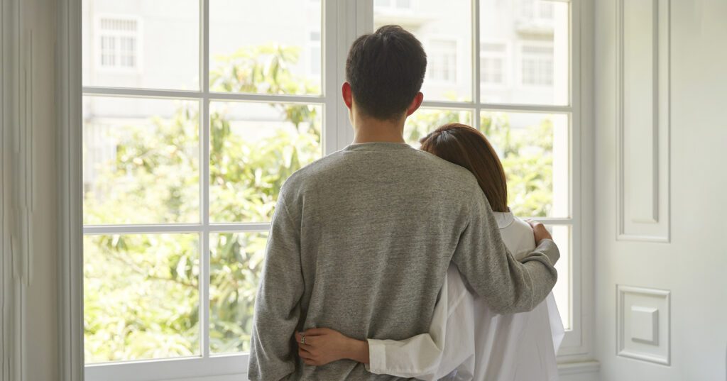 couple looking out window